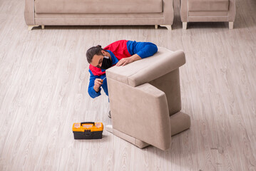 Young carpenter working indoors during pandemic disease