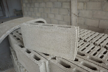 Cement blocks on construction site. Concrete block is made from a mixture of cement and stone and sand. It can bear high compressive strength. - obrazy, fototapety, plakaty