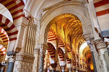 Fototapeta premium Arches of the Mosque-Cathedral in Cordoba. This Mosque and Cathedral is the most important monument in the city of Cordoba.