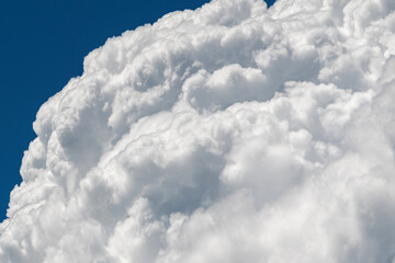 closeup blue sky with aerial white clouds on a sunny day. fluffy soft clouds on a summer day