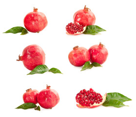 pomegranates with green leaves isolated on white background