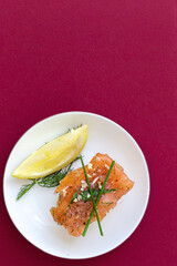 Norwegian smoked salmon canapes with lemon, blue cheese sauce, pepper and salt from above