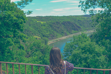 Beautiful mountain landscape with young woman enjoying wanderfull view