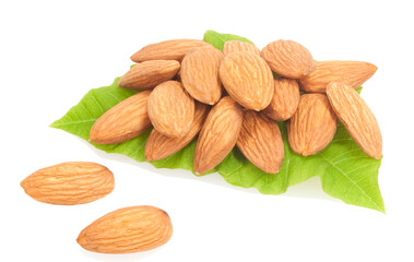 almonds on green leaves isolated on white background