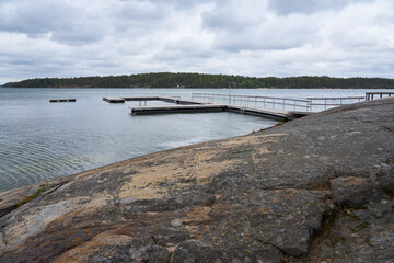Obraz premium Swimming mole on the rokky sea coast in Nauvo, Finland.