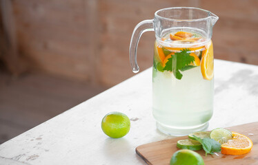 Summer drink ingredients: lime, orange, mint