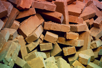 Clay handmade bricks. Abstract pile of bricks background