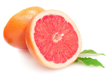 two halfs of juicy grapefruit with green leaves isolated on white