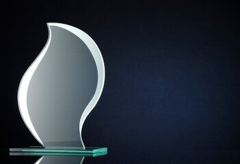 Stylish flame shaped glass trophy with copyspace