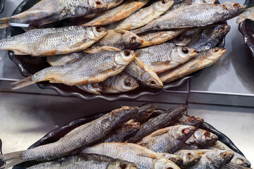 dried fish roach, Rudd. lies on the counter in the market, salty snacks. roach