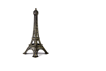 A bronze model of the Eiffel tower on a white background.