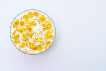 Bowl with cornflakes, milk, yogurt isolated on white background.