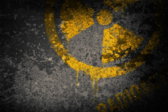 A sign of radioactive danger on a dark background. Infected area. Threat to life. Atomic energy. Illustration.