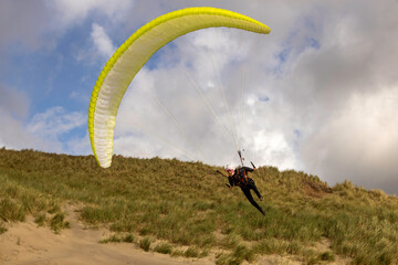 woman flying the paraglider in Netherlands