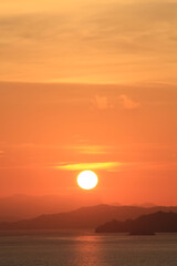 dawn over the mountains in the sea