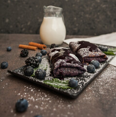 Pancakes with blueberries, cinnamon and milk