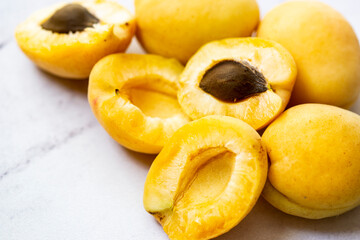 Ripe apricots on a white background closeup photo of seasonal summer fruits