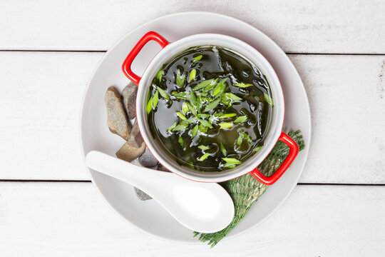 Miso Soup With Seaweed On A White Wood Background