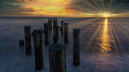 Old Naples Pier on the beach at sunset in Naples, Florida, USA. Travel and tourism concept.