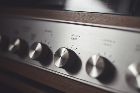 Silver wooden vintage amplifier: Close up of control knobs