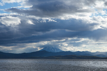 Volcanic seascape in Kamchatka peninsula, Russia. Vilyuchinskiy volcano above the ocean.