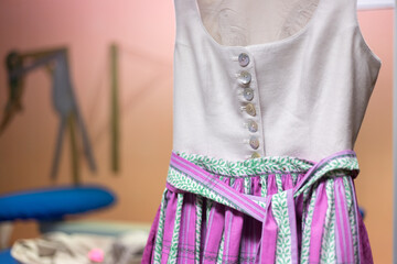 Close up of a traditional dirndl dress. Dressmaker’s workshop