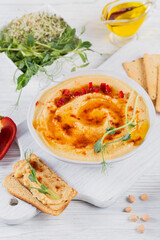 Healthy breakfast with homemade hummus on white wooden background. Diet and Healthy snack food