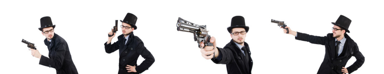 Young detective in black coat holding handgun isolated on white