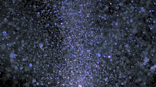 explosion of blue glitter dust on black