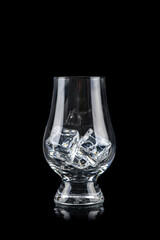 Glass for alcoholic drinks with cun ice on black