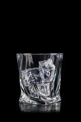 Glass for alcoholic drinks with cun ice on black