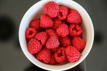 Raspberries in bowl directly above view