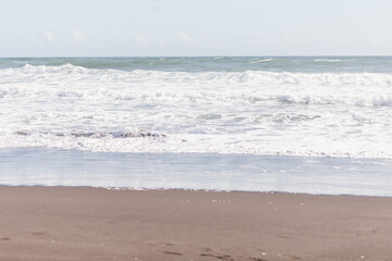Neutral colored ocean beach, seascape background