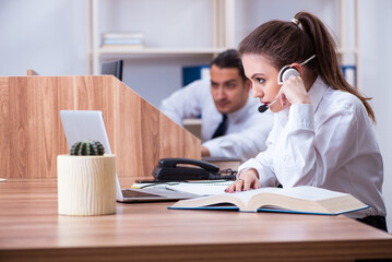 Call center operators working in the office