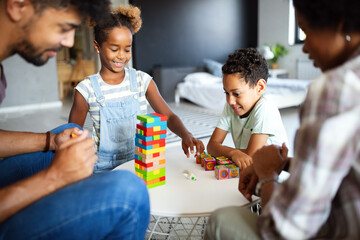 Happy family playing and having fun together at home.