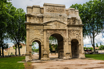 Fototapeta na wymiar Triumphal Arch of Orange (Arc de Triomphe d Orange) is an Ancient Roman monumental gate, built during reign of Augustus. It is one of the biggest and the oldest Triumphal Arch of Roman Gaul. France.