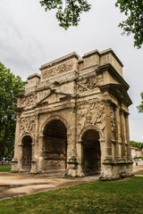 Fototapeta na wymiar Triumphal Arch of Orange (Arc de Triomphe d Orange) is an Ancient Roman monumental gate, built during reign of Augustus. It is one of the biggest and the oldest Triumphal Arch of Roman Gaul. France.