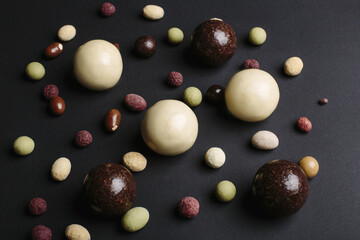 chocolate candies on a black background chocolate dragee