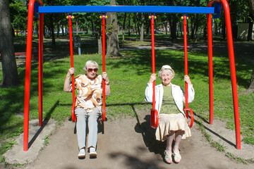 two mature women in park