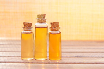 Essence of flowers on table in beautiful glass jar