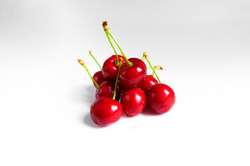 Obraz na płótnie Canvas A lot of fresh cherries on a white background
