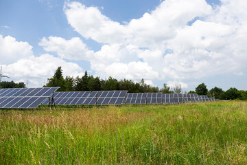 Solar Power Station on the spring flowering Meadow 