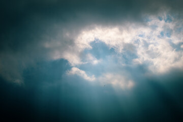 Fototapeta na wymiar sun rays and clouds