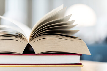 Open book lying on the table in the library