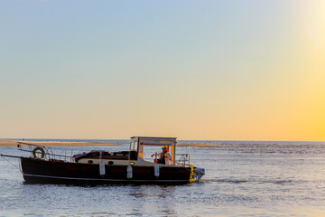 fishing boat at sunset