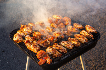 Halal Seasoned Chicken Cooking on a Charcoal Grill