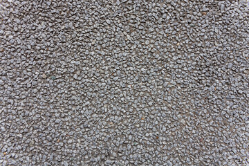A wall with a texture of fine stone. Background for the presentation of solid and strong ideas.