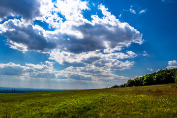 Rural Landscape With Sunlit Clouds In Austria