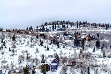Park City Utah neighborhood in winter with colorful homes on snowy hill top