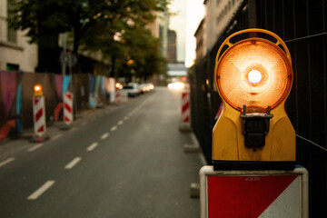 Orange traffic lights. Roadworks with copy space